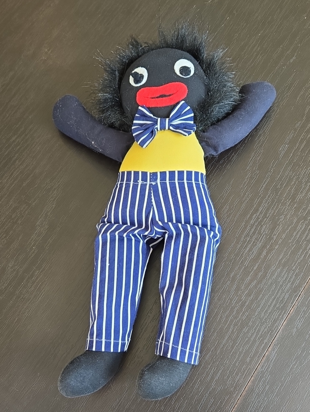 Classic Plush Doll in Black with Yellow Top and Blue Striped Pants